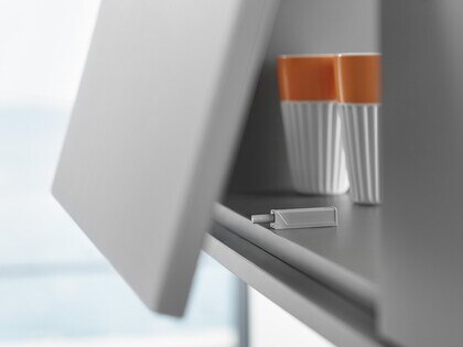 view of TIP ON product inside upper cabinet filled with glasses