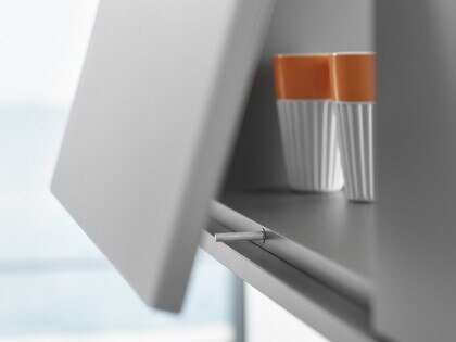 view of TIP ON product inside upper cabinet filled with glasses